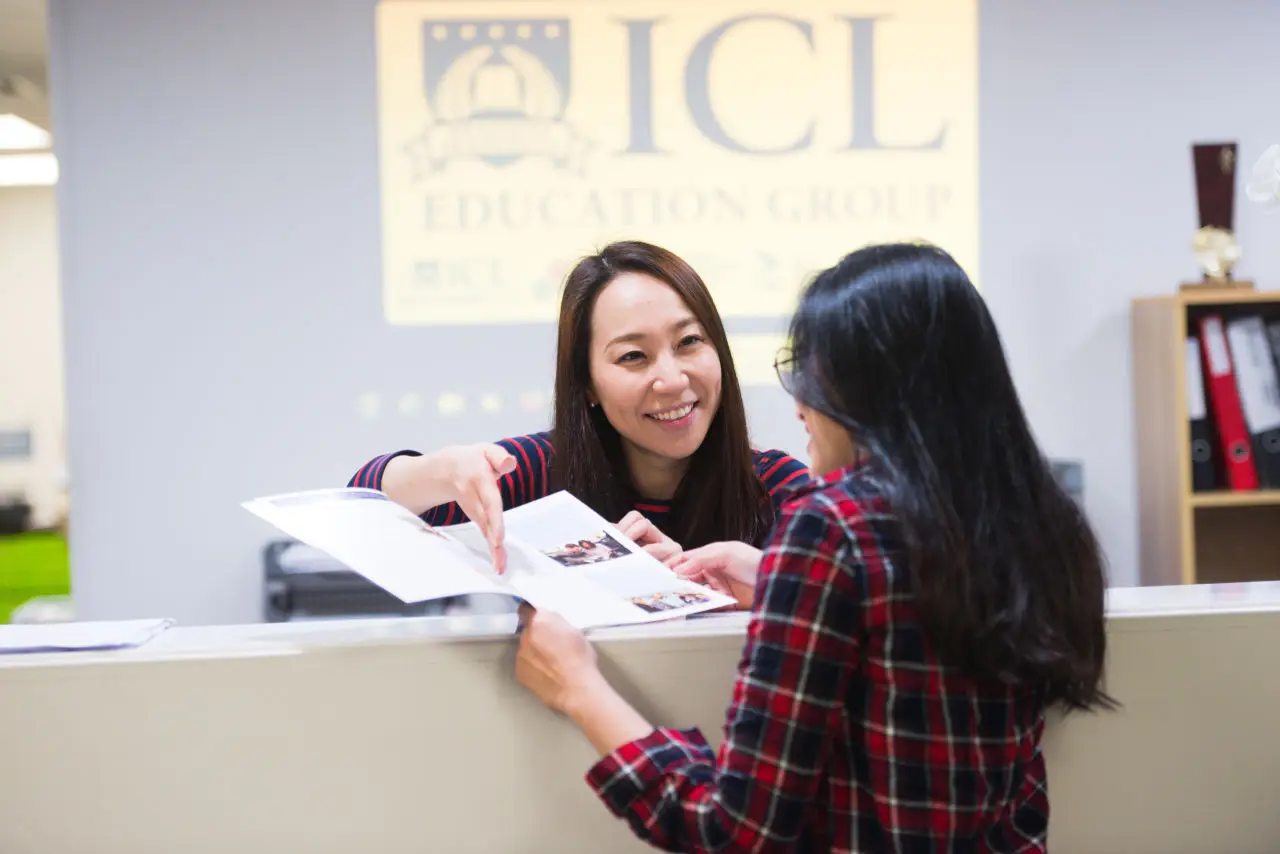 A student chats with our front receptionist at ICL